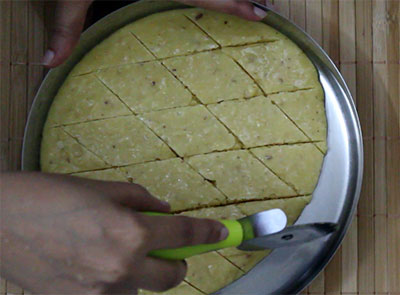 cutting the 7 cup burfi or seven cup sweet