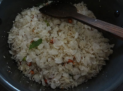 mixing avalakki upkari or poha snacks