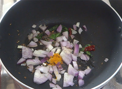 onion, turmeric and asafoetida for avarekalu usli or avrekalu palya
