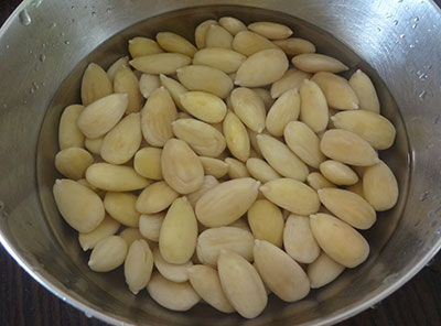 peel and soak the almonds for badam burfi or badam katli