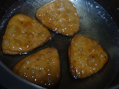 dipping badam puri or badami poori in sugar syrup