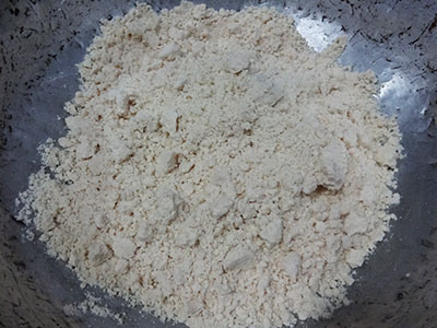 mixing flour and ghee for badam puri or badami poori