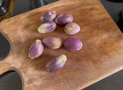 peeled brinjals for badanekayi mosaru gojju recipe