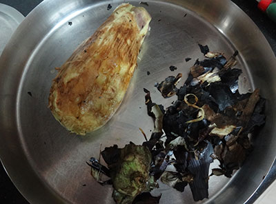 peeling charred brinjal for sutta badanekayi mosaru bajji