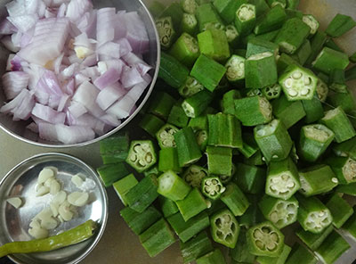 chopped ladies finger and onion for bendekai palya or ladies finger stir fry