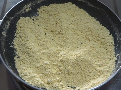 frying the gram flour for besan ladoo or besan unde