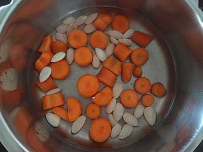 cook badam and carrot for carrot badami payasa or carrot badam kheer