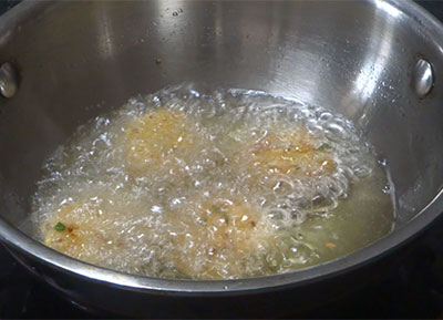deep frying masala vada or masala vade or chattambade or ambode