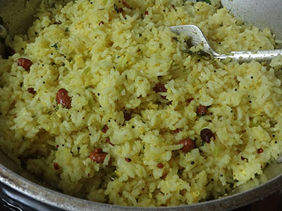 mixing lemon rice or chitranna