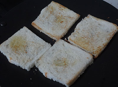 toasting the bread slices for curd sandwich