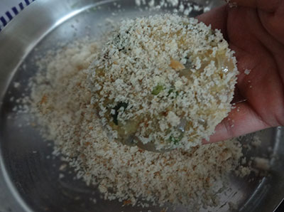 rolling in the bread crumbs for cutlet or potato peas cutlet