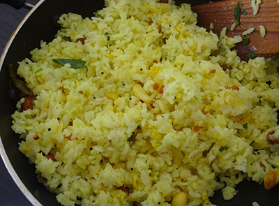 adding rice for bellulli chitranna or garlic rice