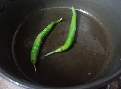 frying green chilies for girmit
