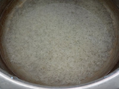 cooking rice for halu payasa or rice kheer