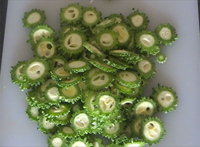 bitter gourd slices for hagalakayi or bitter gourd fry