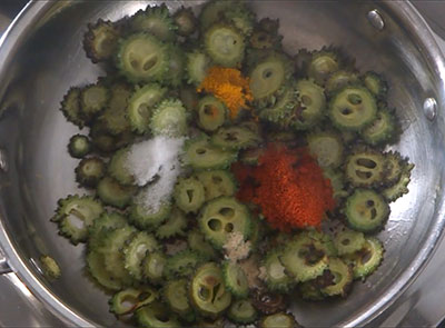 salt, chilli powder, turmeric and hing for hagalakayi or bitter gourd fry