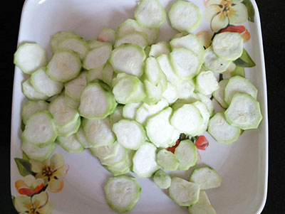 slicing ridgegourd for ridge gourd dosa or heerekai dose