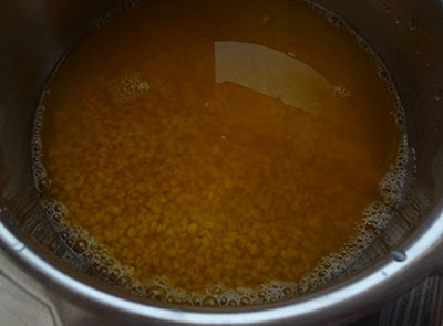 rinse and cook green gram dal for hesaru bele saaru or mung dal rasam