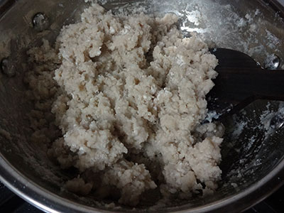 mixing the flour for jolada rotti or jowar bhakri