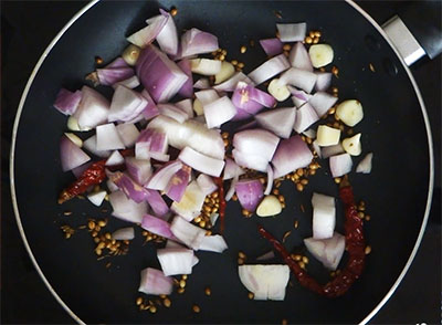 fry onion and garlic for kadlekalu saru or kadle kaalu sambar
