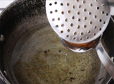 deep frying athrasa or kajjaya