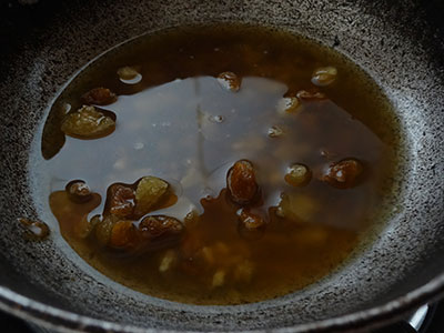 boiling jaggery and water for athrasa or kajjaya