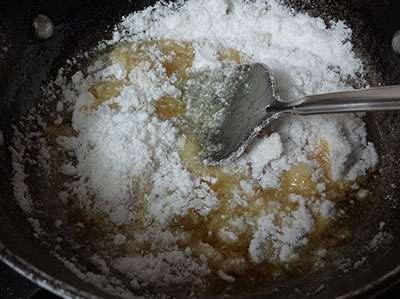 adding rice flour to the jaggery syrup for athrasa or kajjaya