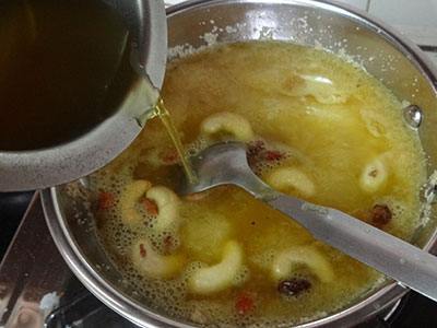 adding sugar syrup for kesari bath or rava kesari
