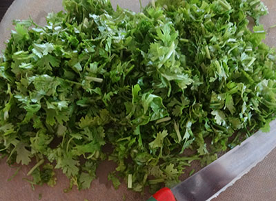 chop coriander leaves for kothambari soppu thambli or coriander leaves tambli