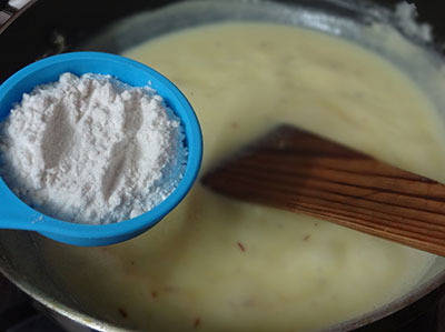 stirring milk and milk powder for milk peda or doodh peda