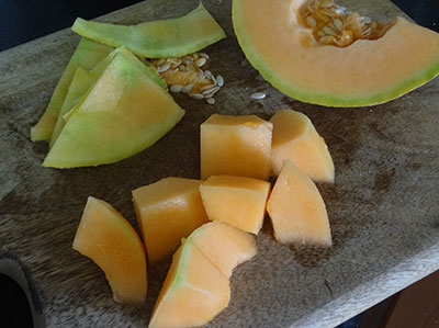 Chop musk melon for kharbuja juice or musk melon milkshake