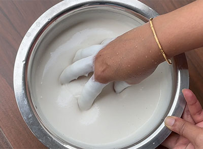 mixing the batter for mysore mylari dosa recipe