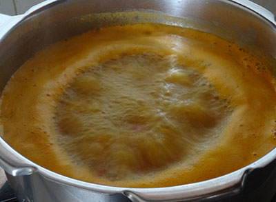 boiling mysuru tomato saaru or mysore rasam