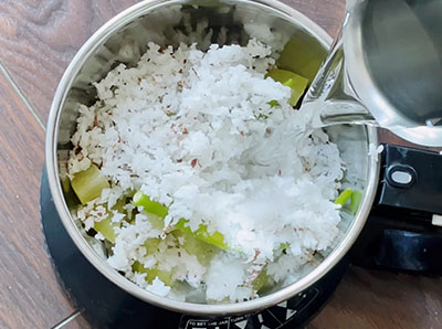 grind gooseberry and coconut for nellikai tambli or amla tambuli recipe