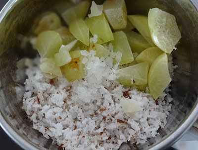 grind gooseberry and coconut for nellikai chutney or amla chutney