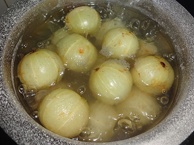 boiling gooseberries for nellikai uppinakayi or amla pickle