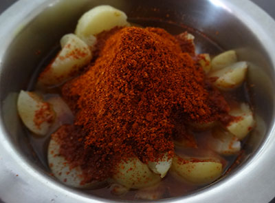 mixing spice powder for nellikayi uppinakayi or amla pickle