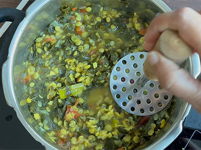 mashing dal for nugge soppu or drumstick leaves or moringa dal