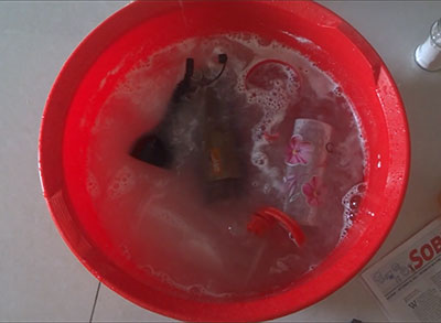 straining the tamarind pulp for how to clean oil bottle or container