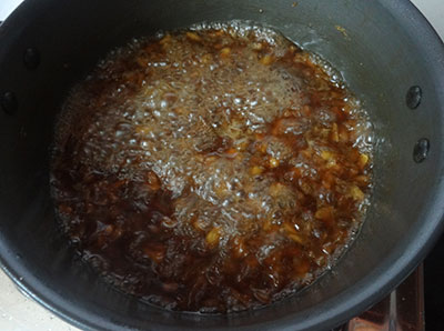 cooking pineapple in jaggery syrup for pineapple or ananas payasa