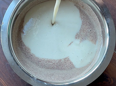 grinding dal, methi seeds and poha for ragi godhi dose or ragi flour wheat flour dosa