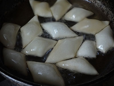 deep frying sweet shankar poli or shankar pali