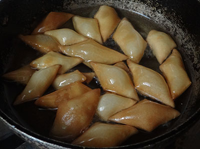 deep frying sweet shankar poli or shankar pali