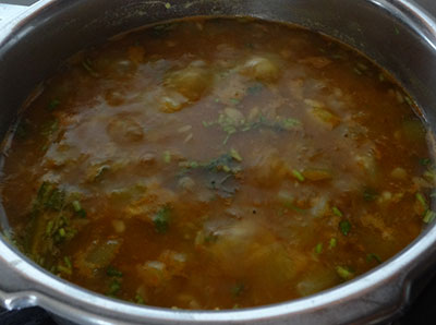 boiling sorekai sambar or bottle gourd sambar