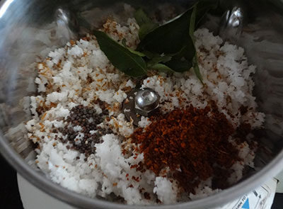 grind coconut and red chili for sorekai palya or bottle gourd stir fry