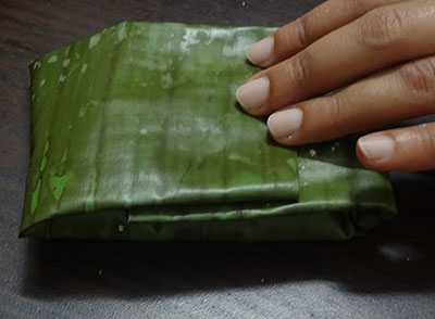 batter inside the banana leaf for southe gatti or cucumber dumplings