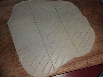 rolling the dough for suruli puri or suruli poori