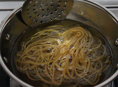 frying kara sev or ompudi or thin plain sev