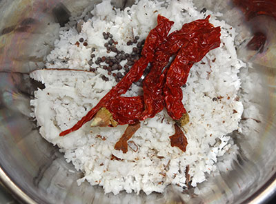 grind coconut and red chili for thondekai palya or ivy gourd stir fry