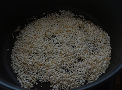 dry roasting the rice for uddina vade or medu vada